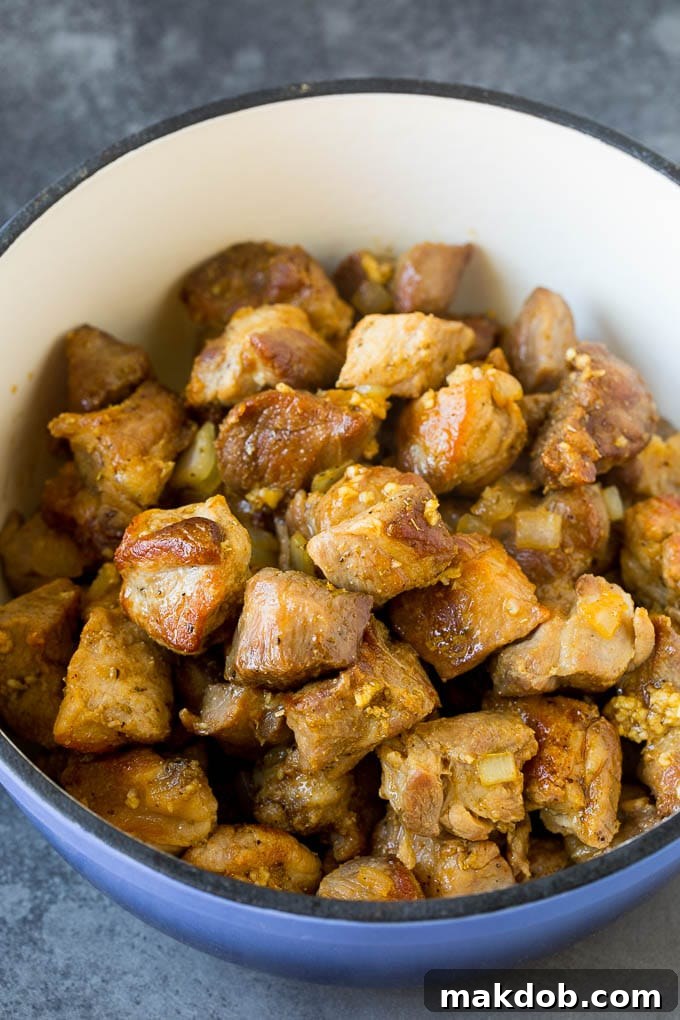 Cubes of pork cooked to a golden brown.