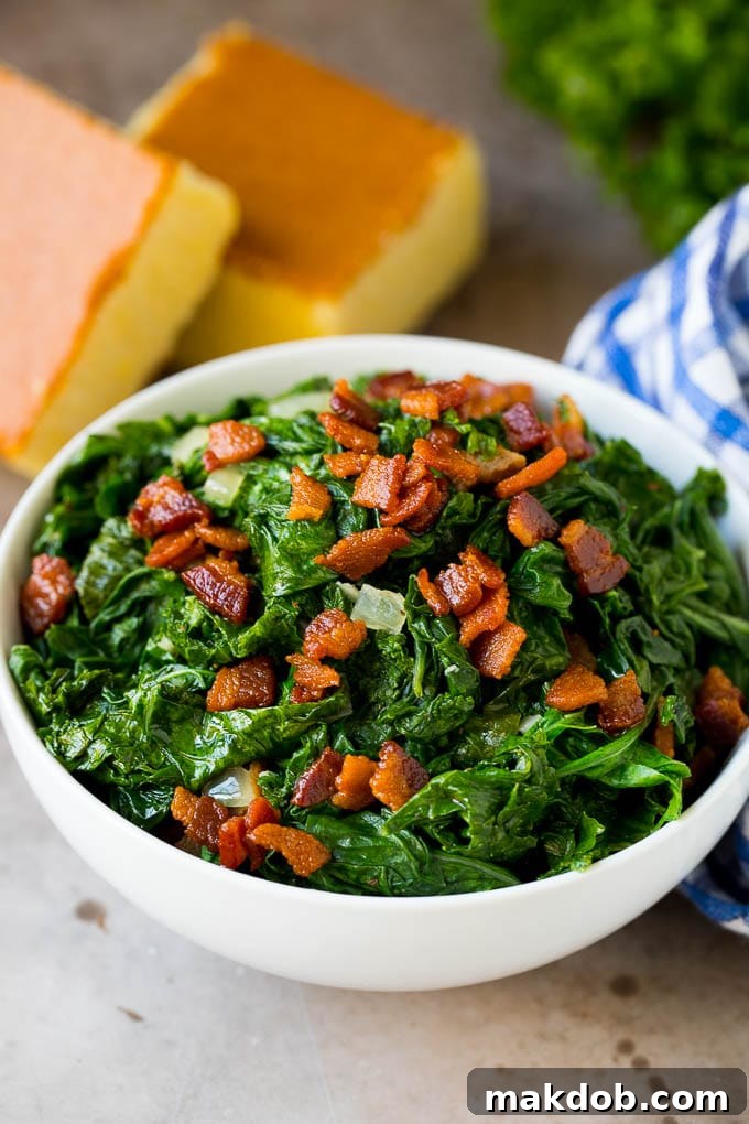 These Southern style mustard greens are cooked with smoky bacon and seasonings until tender and flavorful. A bowl of mustard greens and bacon, served with cornbread.