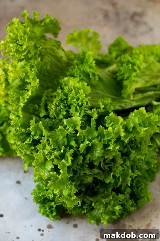 These Southern style mustard greens are cooked with smoky bacon and seasonings until tender and flavorful. A bunch of raw mustard leaves.