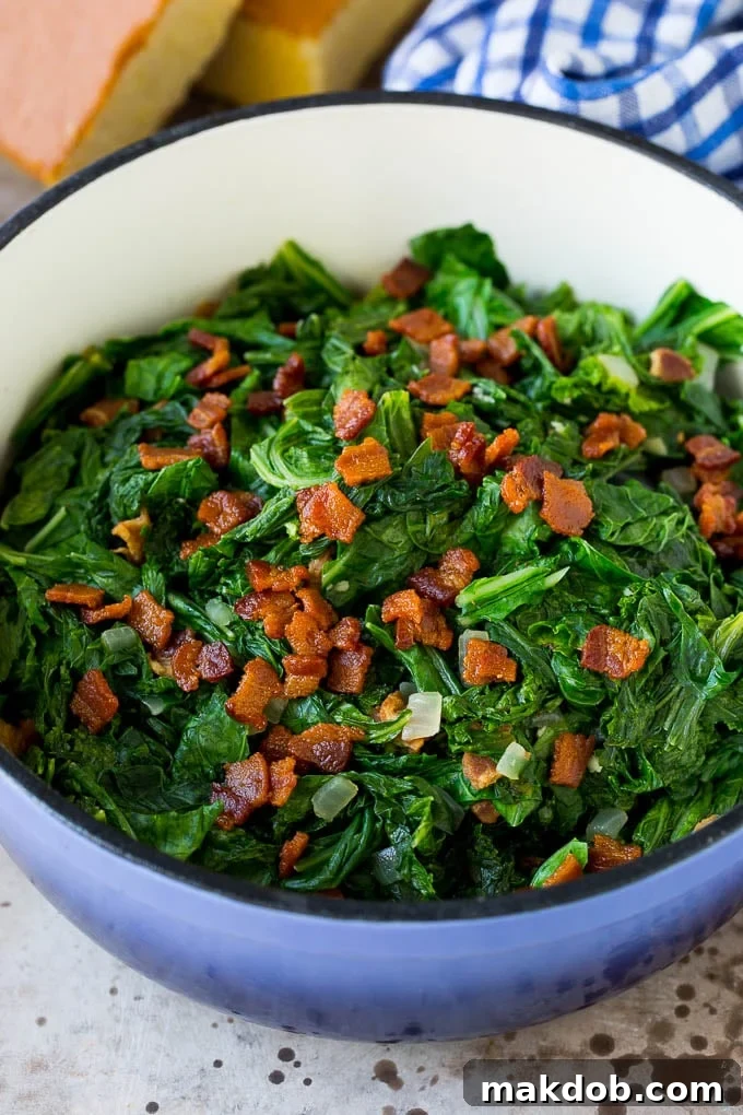 These Southern style mustard greens are cooked with smoky bacon and seasonings until tender and flavorful. A pot of mustard greens topped with bacon.