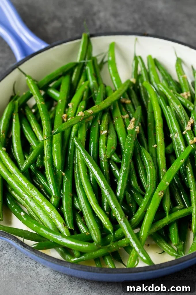 These sauteed green beans are cooked in butter, garlic and an assortment of fresh and dried herbs. Cooked beans tossed with garlic and herbs.