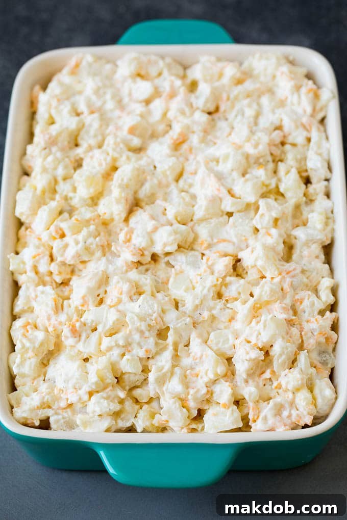 Creamy, golden-brown potatoes in a large, inviting baking dish, fresh from the oven.