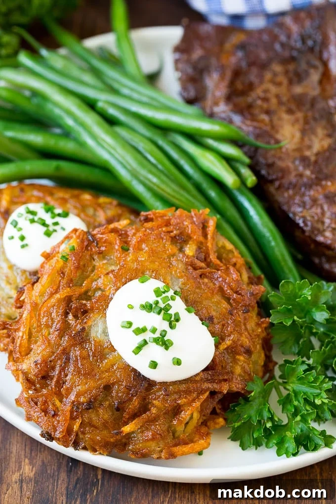 Potato pancakes served with steak and green beans. Potato pancakes served with steak and green beans.