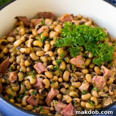 Hoppin' John: A Southern Tradition for Good Fortune 2 A pot of Hoppin' John made with stewed black eyed peas, ham and vegetables.