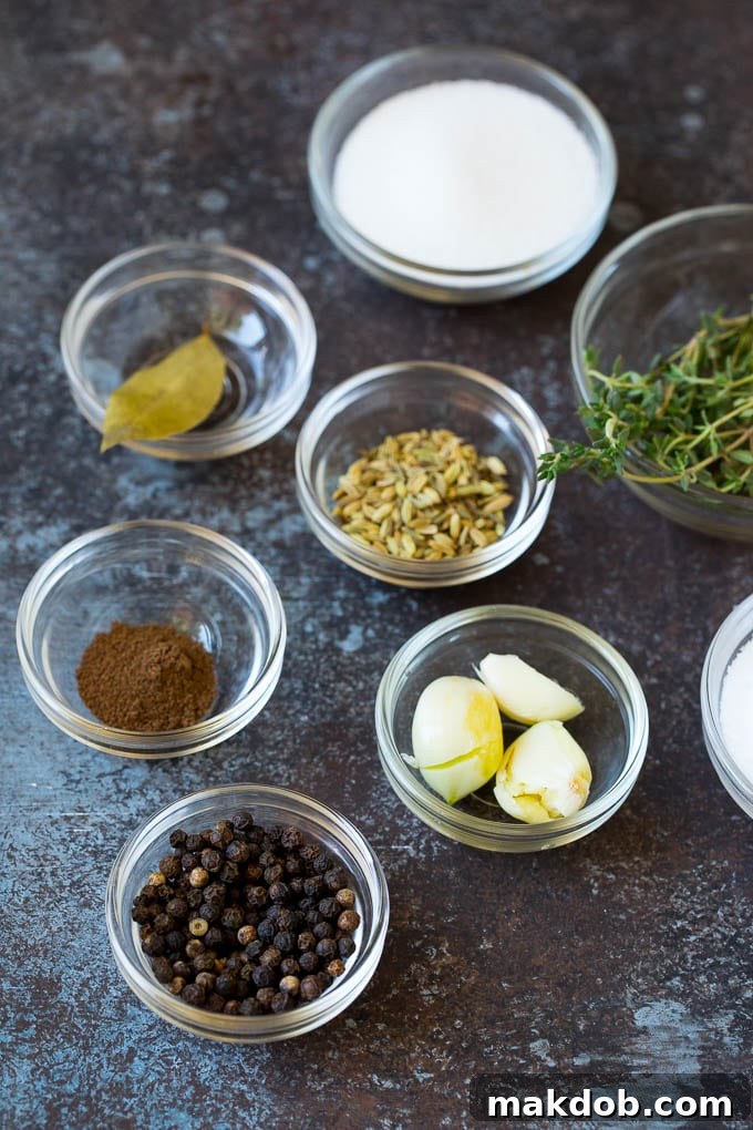 Essential ingredients for a perfect pork chop brine. Bowls of various spices, salt, sugar, and fresh herbs laid out for preparing pork chop brine.