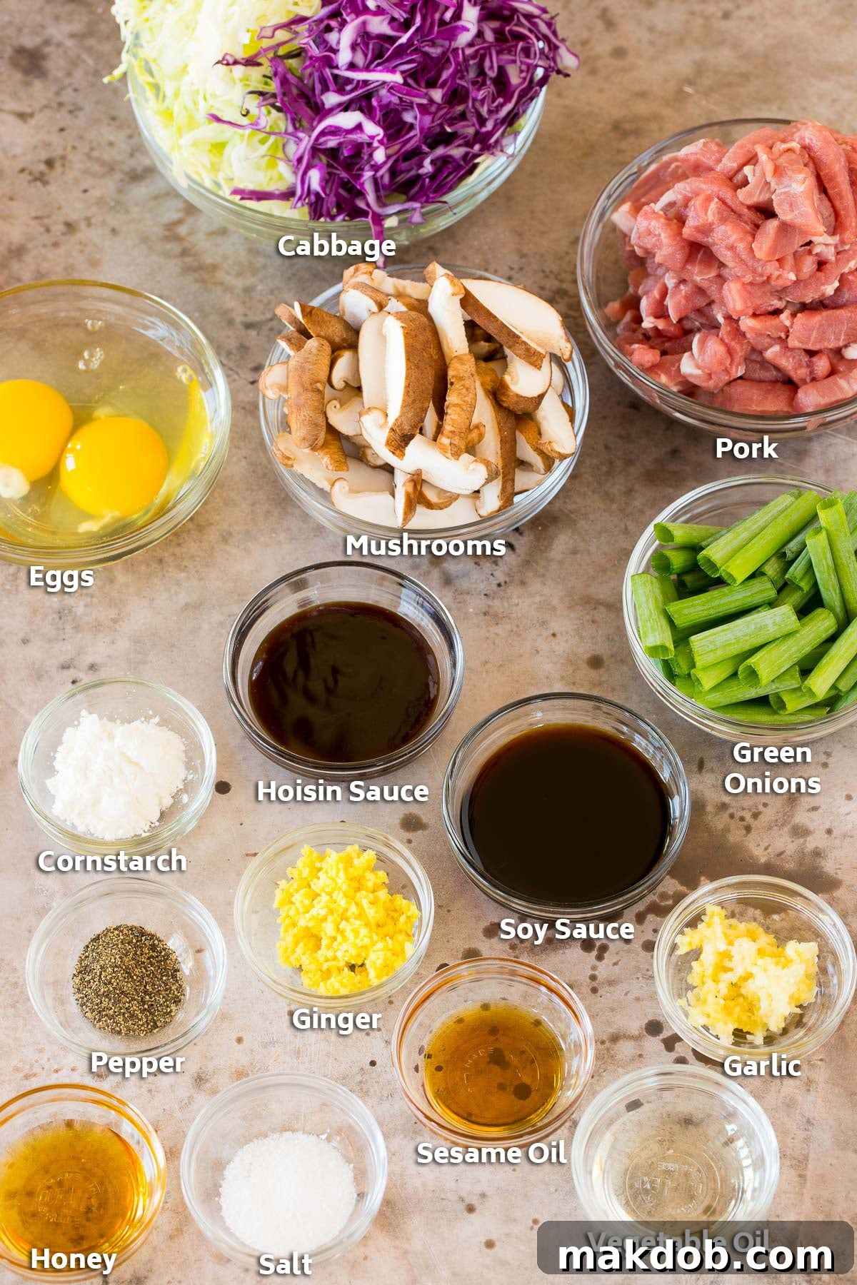 Mandarin Pork Wraps 3 Bowls of ingredients including pork, vegetables, eggs and seasonings.