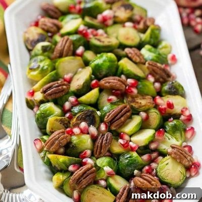 These pomegranate pecan brussels sprouts are a healthy and colorful side dish with just 5 ingredients and 5 minutes of prep time.