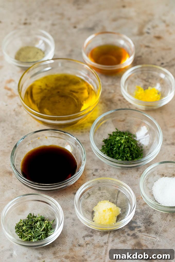 This baked cod is marinated with olive oil, garlic and fresh herbs, then roasted to tender and flaky perfection. Bowls of marinade ingredients including fresh herbs, garlic, olive oil and seasonings.