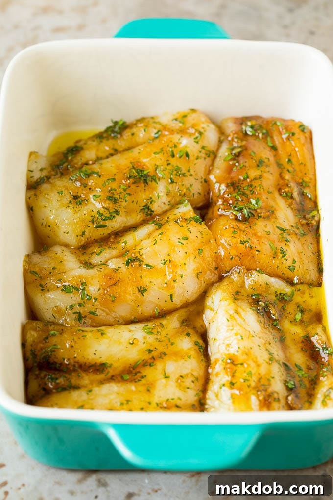 This baked cod is marinated with olive oil, garlic and fresh herbs, then roasted to tender and flaky perfection. Marinated fish in a baking fish.