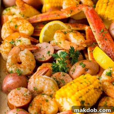 Southern Seafood Jamboree 2 A Low Country Boil with shrimp, crab, sausage corn and potatoes on a sheet pan.