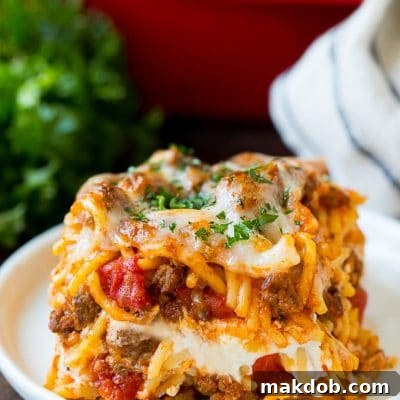 Opulent Spaghetti Casserole 2 A slice of million dollar spaghetti topped with melted cheese.