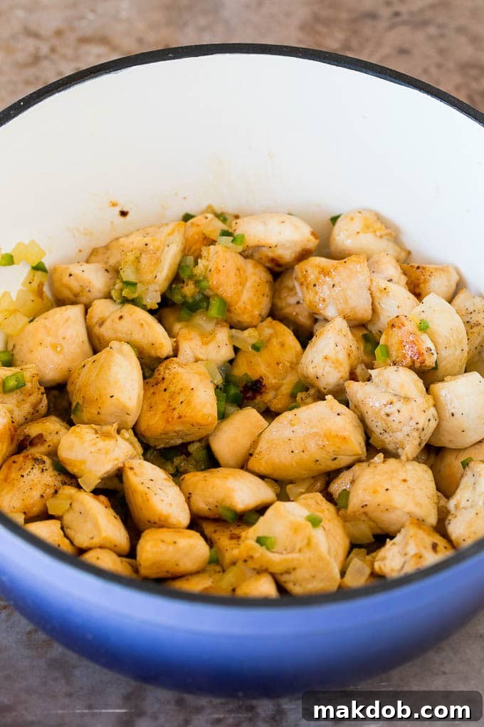 This white chicken chili is a creamy blend of chicken, chilies, beans and spices, all simmered together Sauteed chicken, onions and jalapenos in a pot.