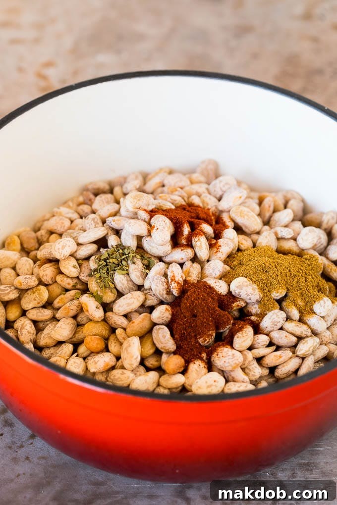 Pinto beans in a pot with spices.