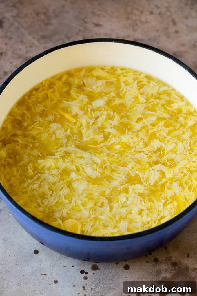 Chicken broth with beaten eggs swirled into it.