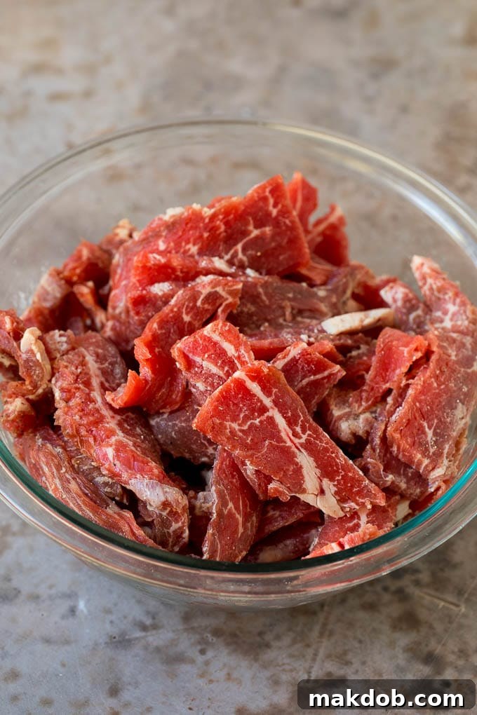 This kung pao beef is a combination of thinly sliced steak, bell peppers, onions and roasted peanuts, all in a savory and spicy sauce. Thinly sliced flank steak coated in corn starch and seasonings.