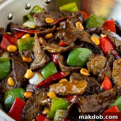 Spicy Szechuan Kung Pao Beef 2 Kung pao beef with peppers and peanuts in a saute pan.