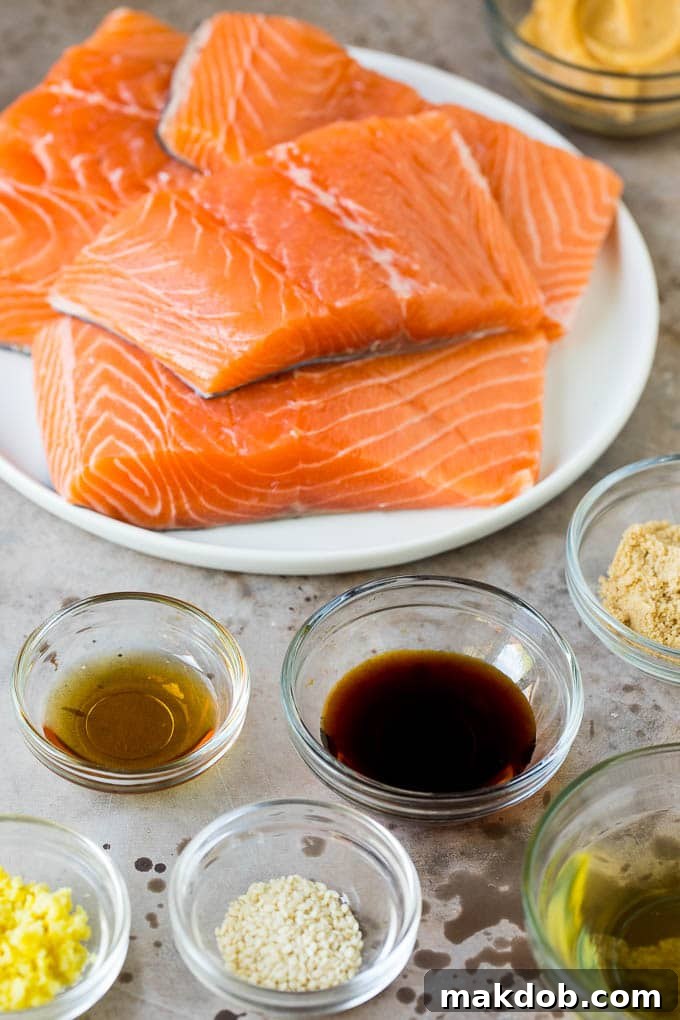 Salmon fillets with an assortment of ingredient bowls.