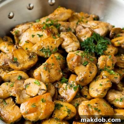 Garlic butter chicken and mushrooms topped with parsley.