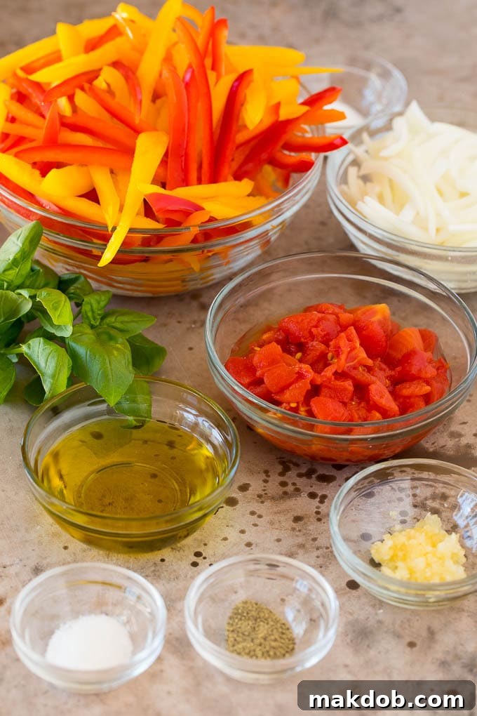 Fresh ingredients for a delicious peperonata Bowls filled with fresh ingredients for making peperonata: vibrant tomatoes, glistening olive oil, a selection of aromatic seasonings, and a variety of colorful bell peppers.