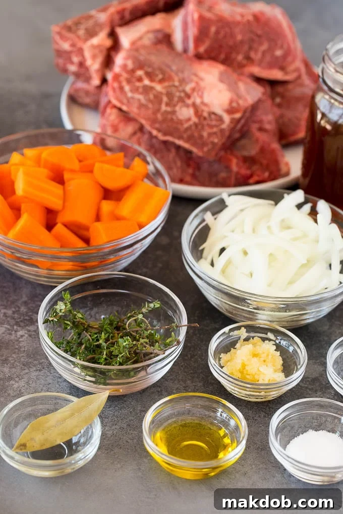 Bowls of ingredients including vegetables, herbs and olive oil for short ribs.