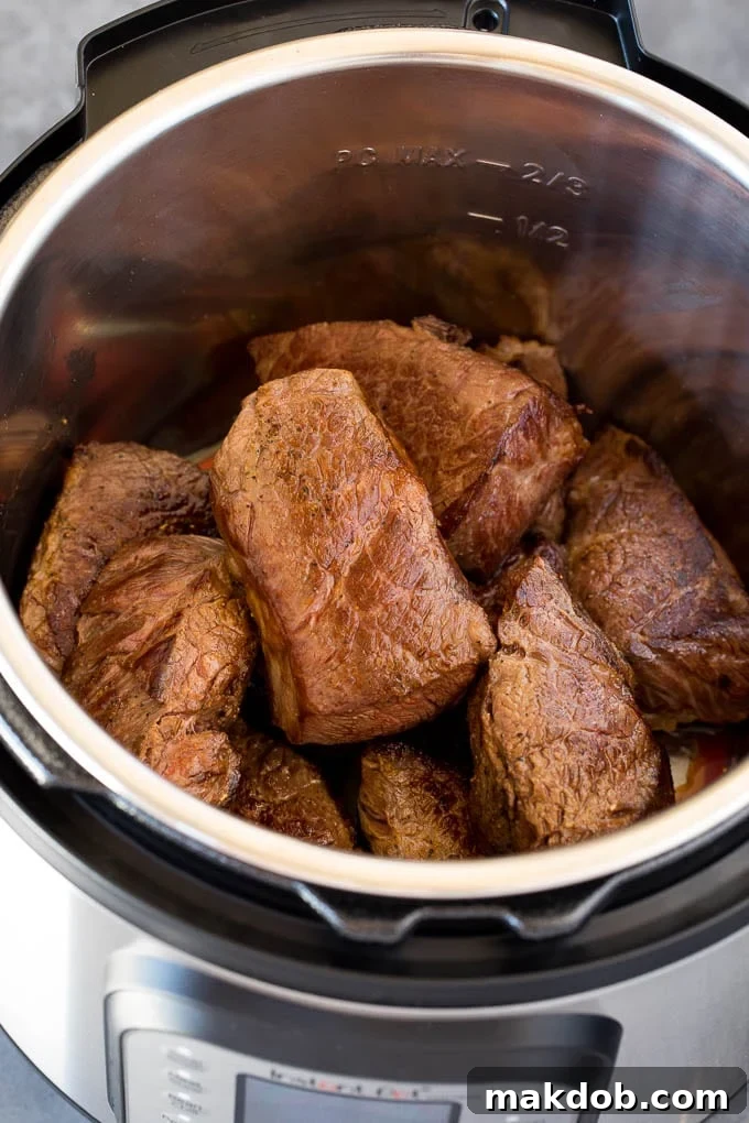 Short ribs seared in a pressure cooker to build rich flavor.