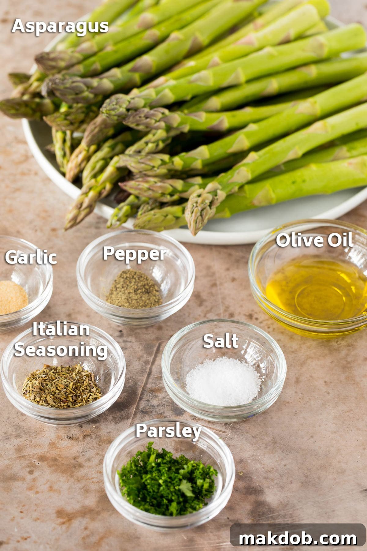 Ingredients including asparagus, olive oil and seasonings.