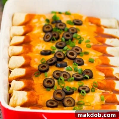 Melt-in-Your-Mouth Cheese Enchiladas 2 A dish of cheese enchiladas topped with olives and green onions.