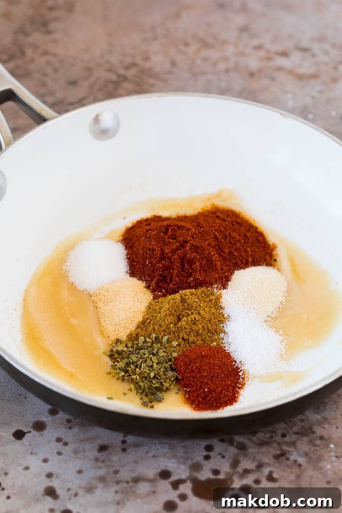 Cooking Enchilada Sauce Roux A pan with roux, chili powder, and other spices, being prepared for enchilada sauce.