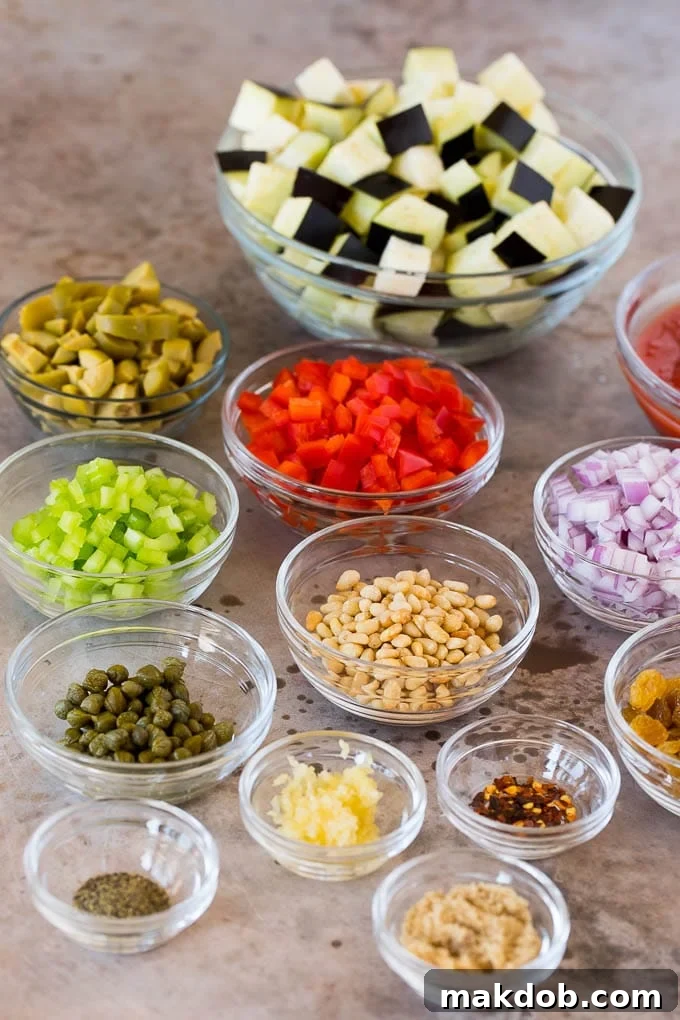 Bowls of meticulously prepared ingredients for caponata, including perfectly diced eggplant, finely chopped red onion, vibrant bell peppers, crisp celery, pungent capers, briny green olives, luscious golden raisins, and aromatic fresh herbs, all arranged and ready to be transformed into an authentic Sicilian delicacy.