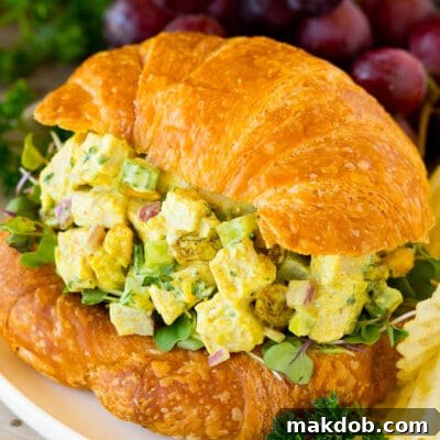 Curry chicken salad served on a croissant.