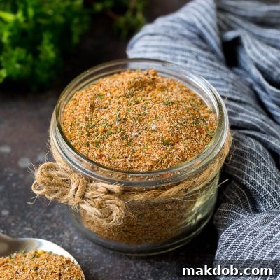 A jar of homemade jerk seasoning, ready to infuse bold Caribbean flavors into any dish.