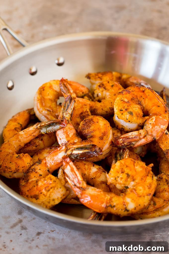 Cooked shrimp in a skillet.