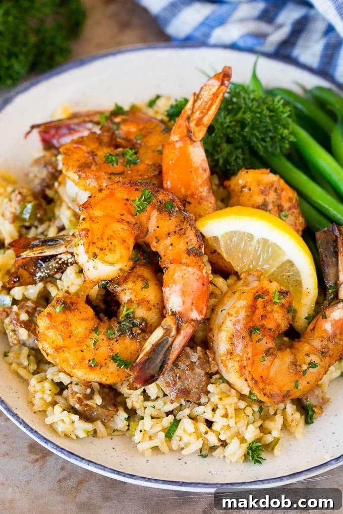 Cajun shrimp served over rice with green beans.