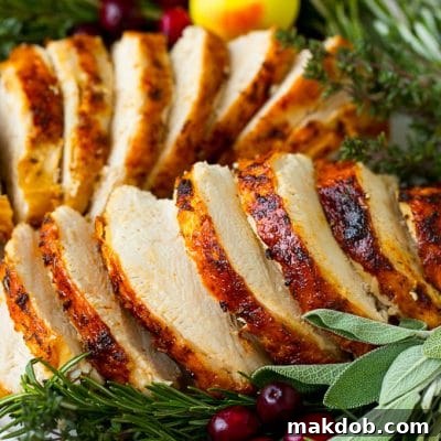 Cooked Instant Pot turkey breast sliced and served on a platter.