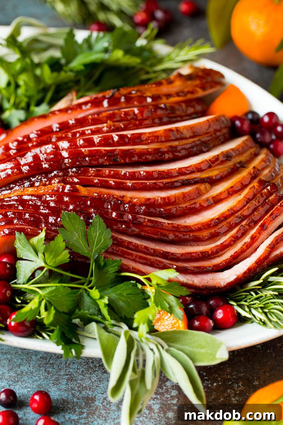 Perfectly sliced spiral ham arranged on a beautiful serving plate, ready to be enjoyed.