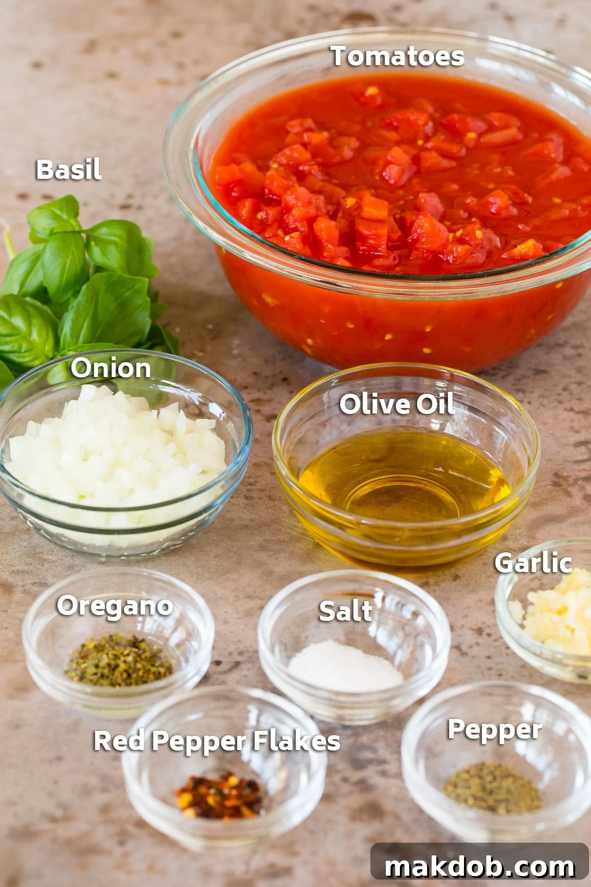 Robust Homemade Marinara 3 Bowls neatly arranged with fresh ingredients for homemade marinara sauce, including vibrant red tomatoes, golden olive oil, aromatic garlic cloves, and sprigs of green basil and oregano.