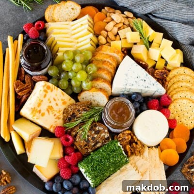 Crafting the Ultimate Cheese Board Experience 2 The best cheese board with assorted cheeses, bread, crackers, fruit and nuts.