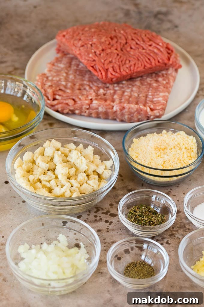 Bowls of fresh ingredients for making Italian meatballs, including ground meat, bread, milk, and herbs.