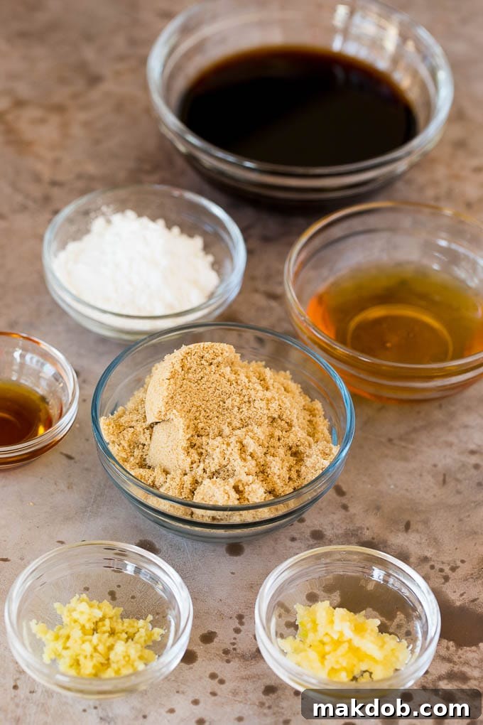 Fresh Ingredients for Your Perfect Teriyaki Sauce Glass bowls showcasing the fresh ingredients for homemade teriyaki sauce: vibrant soy sauce, rich brown sugar, aromatic minced garlic, and zesty fresh ginger.
