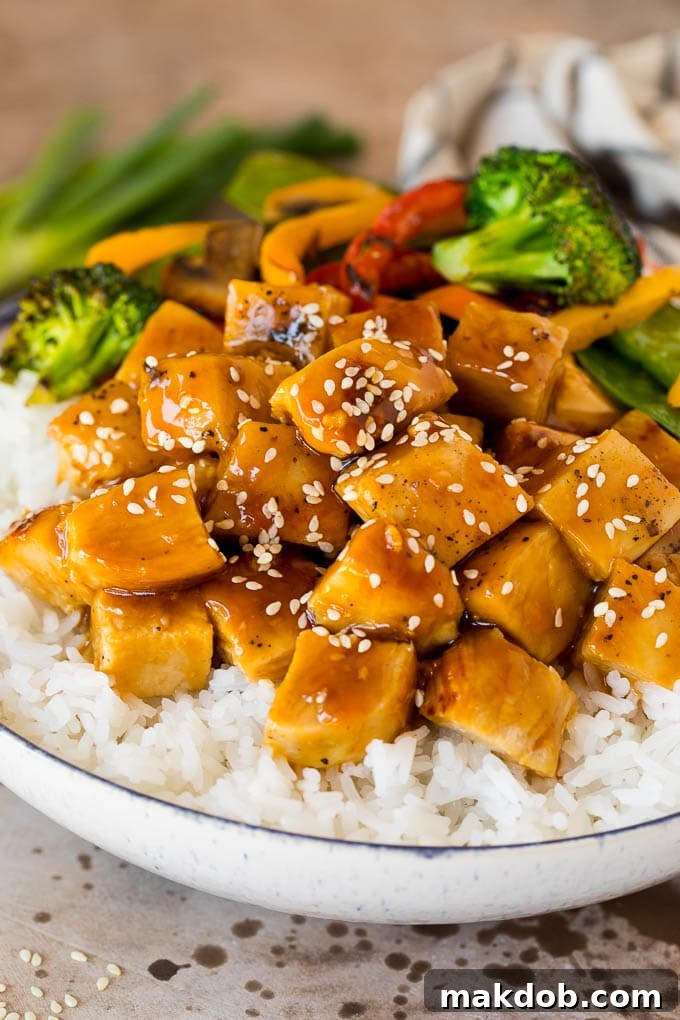 Delicious Teriyaki Chicken with Rice and Vegetables Tender diced teriyaki chicken served alongside fluffy white rice and a medley of colorful, crisp-tender vegetables, all glistening with homemade teriyaki sauce.