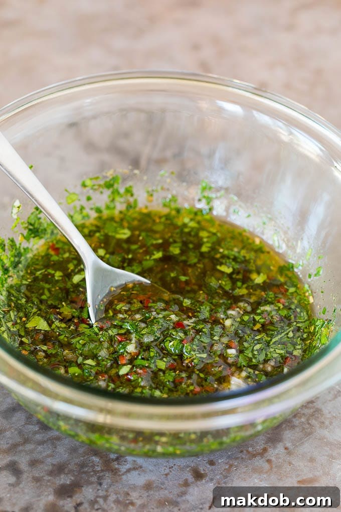 A bowl of vibrant homemade chimichurri sauce, freshly prepared.