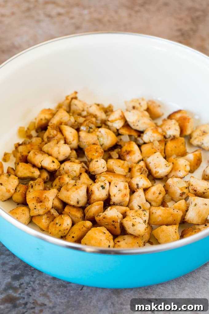 Sauteed chicken in a pan.