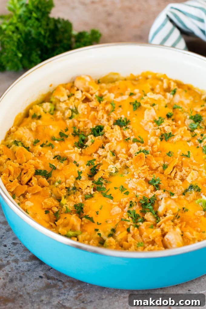 Golden Chicken Broccoli Bake 6 A pot of finished chicken broccoli casserole, topped with golden-brown crackers and sprinkled with fresh parsley.
