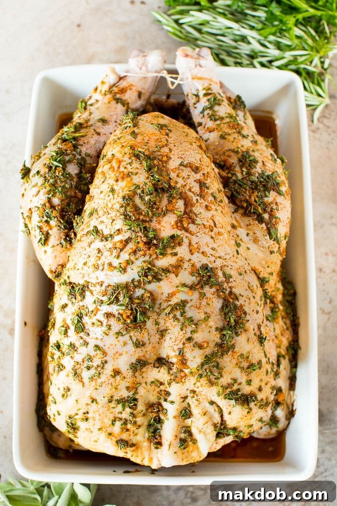 Raw Turkey with Marinade A raw turkey with marinade poured over it.