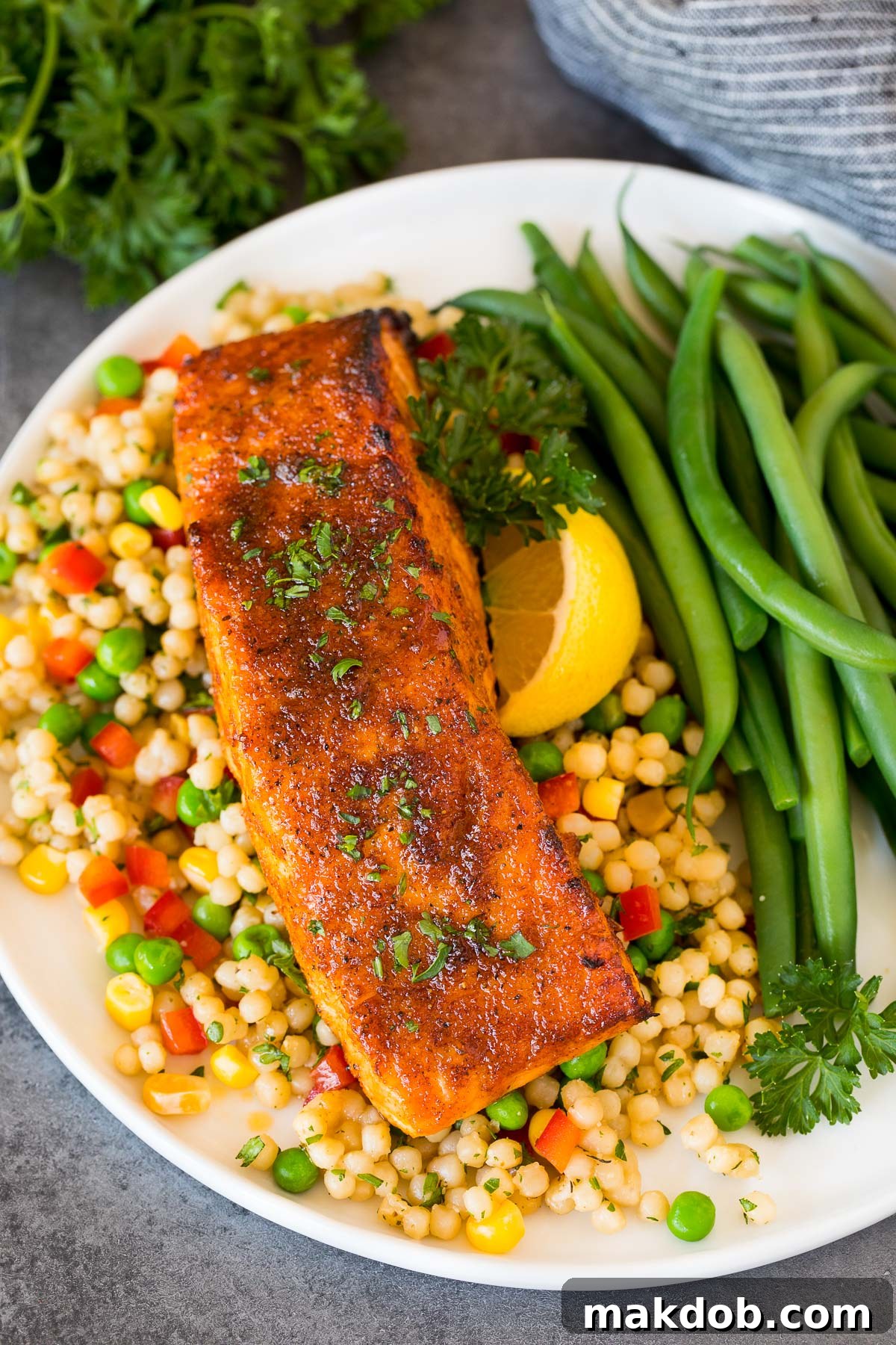 Signature Salmon Seasoning Blend 6 Salmon fillet baked with salmon seasoning served with couscous and green beans.