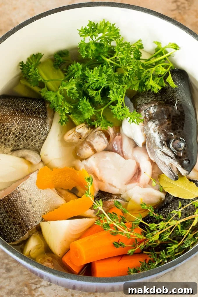 This bouillabaisse is French seafood stew with fresh fish, shrimp, clams and mussels, all simmered together in a flavorful broth. A pot of fish trimmings and vegetables for stock.
