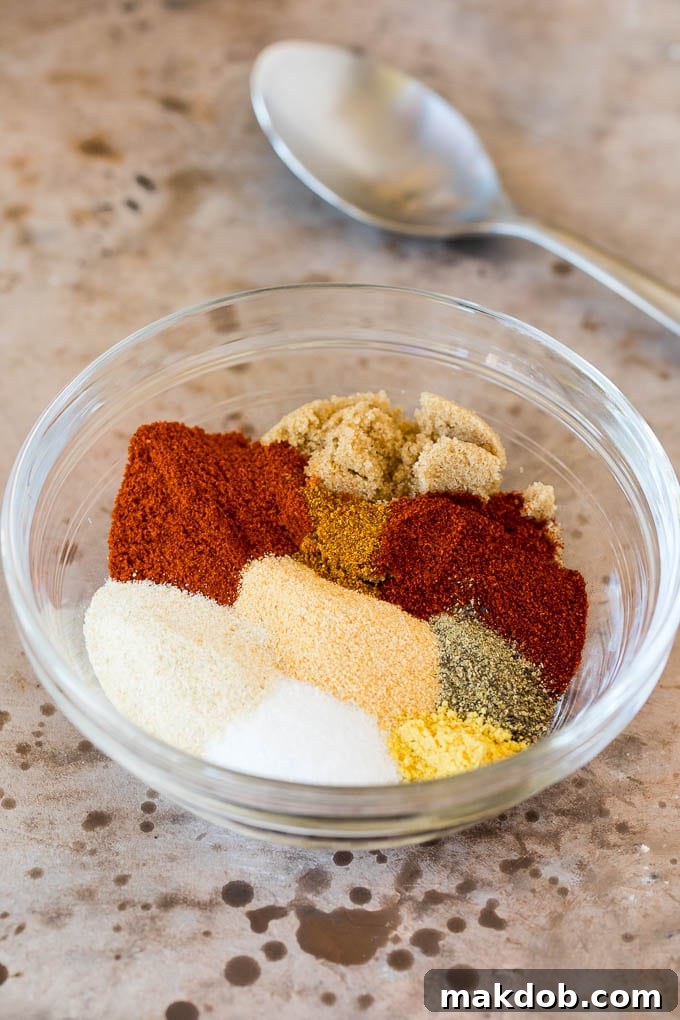 A bowl of assorted spices, ready to be mixed for a flavorful rub.