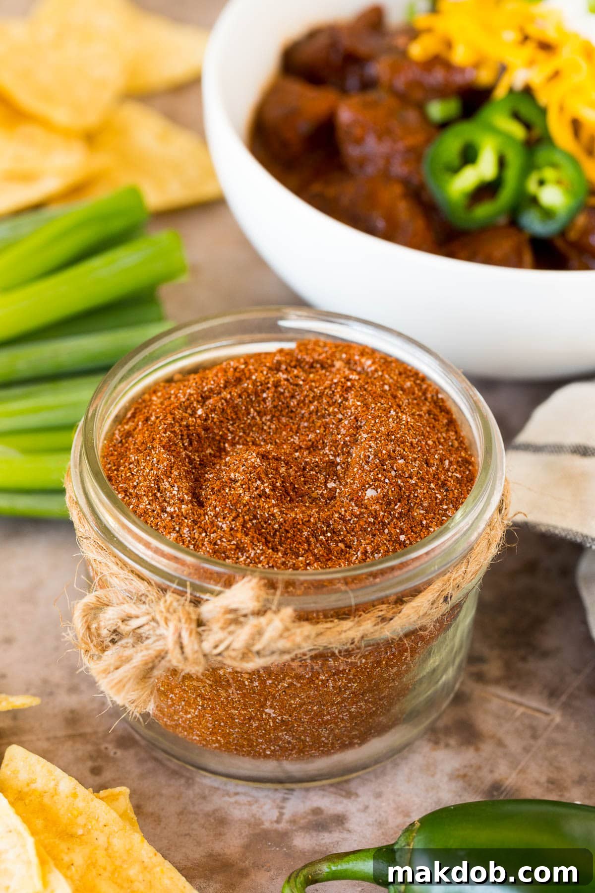 A jar of homemade chili seasoning, ready for use.