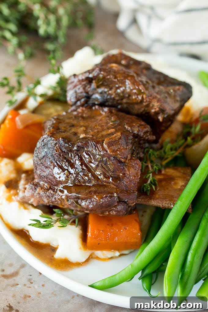 Fall-Off-The-Bone Slow Cooker Short Ribs 6 Slow cooker short ribs served with mashed potatoes and green beans.