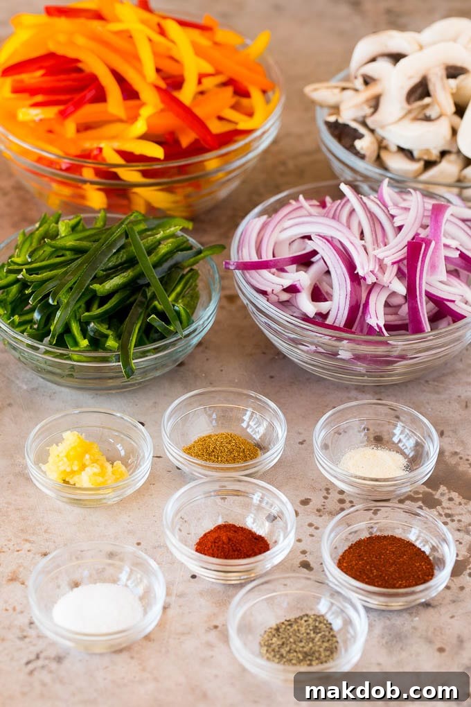 Plant-Powered Fajitas 3 Bowls filled with a colorful array of fresh, spiced, and sliced vegetables, ready for the pan, showcasing the preparation stage of the vegetarian fajitas.